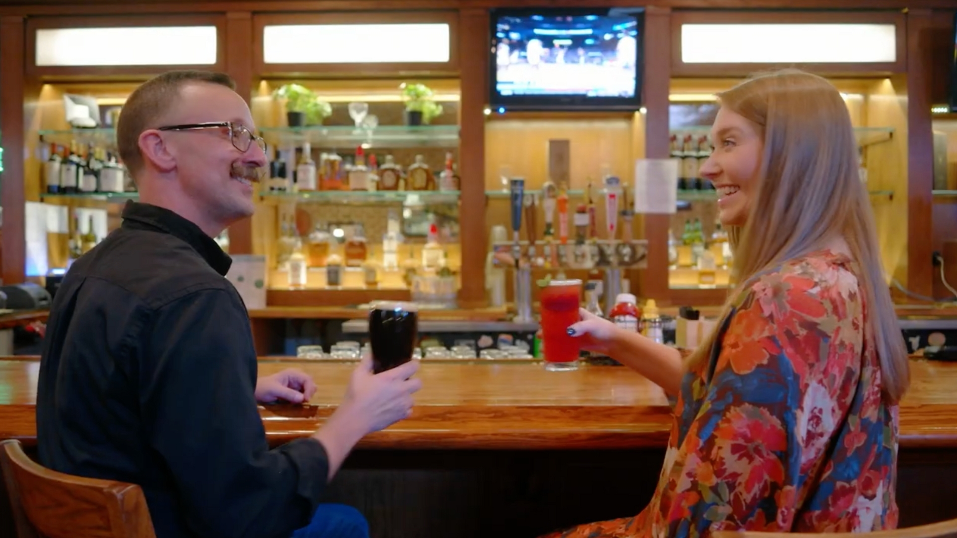 Screenshot of a video at Maguire's Irish Pub with Nick Ramey from Gigbag Media and Christina Colantonio from CFC getting ready to cheers a couple beers.