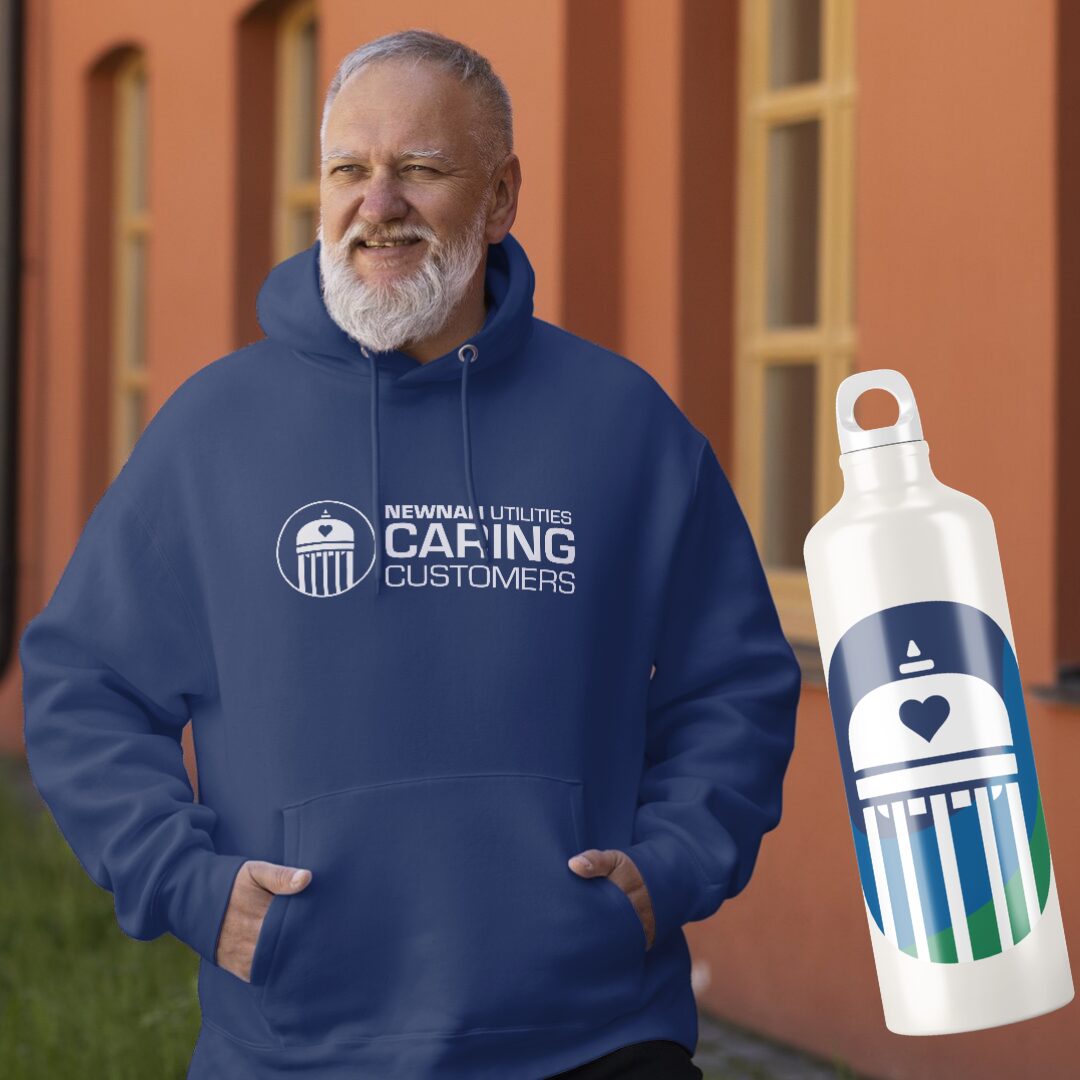 Mockup of the Caring Customers logo on a men's blue sweatshirt and water bottle