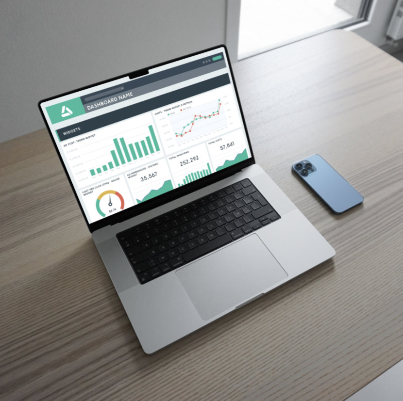 Screenshot Laptop on a desk showing a digital marketing dashboard with real-time data charts and analytics insights.
